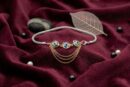 Dual-tone silver bracelet for women with blue evil eye charms and braided chain